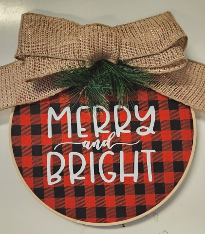 Embroidery Hoop with bow and Merry and Bright printed on it. 