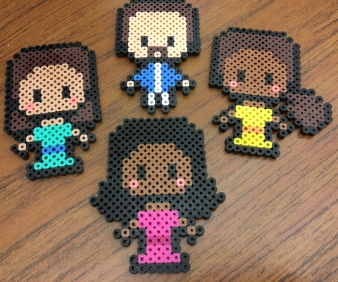 Angelica, Eliza, Peggy, and Hamilton in their pixel art forms