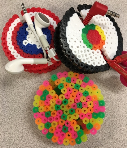 Captain America shield, sushi, and colorful earbud holders
