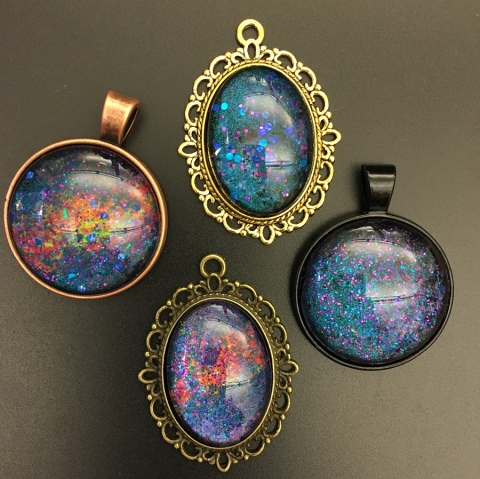 Four examples of galaxy pendants