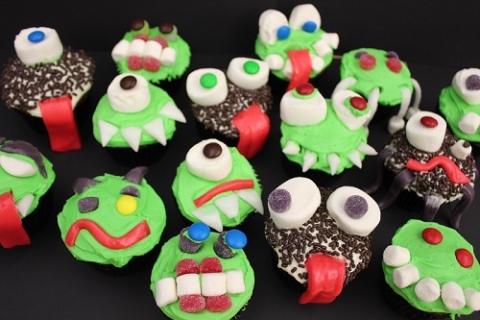 Examples of Creepcakes with green frosting, marshmallow eyes, and airhead tongues