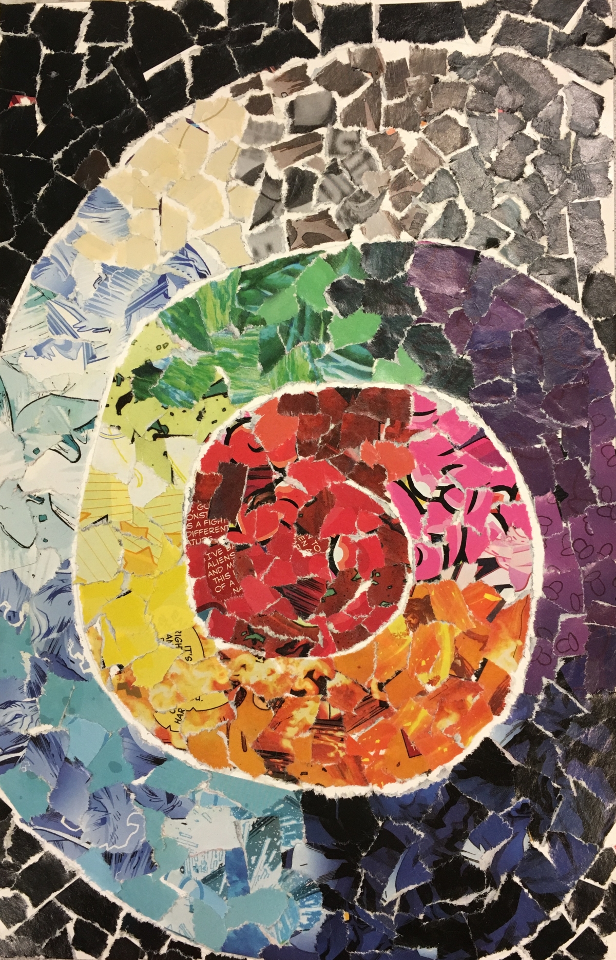 a colorful mosaic art spiral made of small pieces of magazine pages
